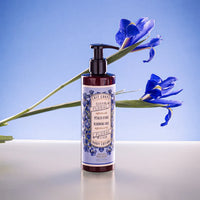 Bottle of Panier des Sens Blooming Iris Body Lotion with elegant packaging.