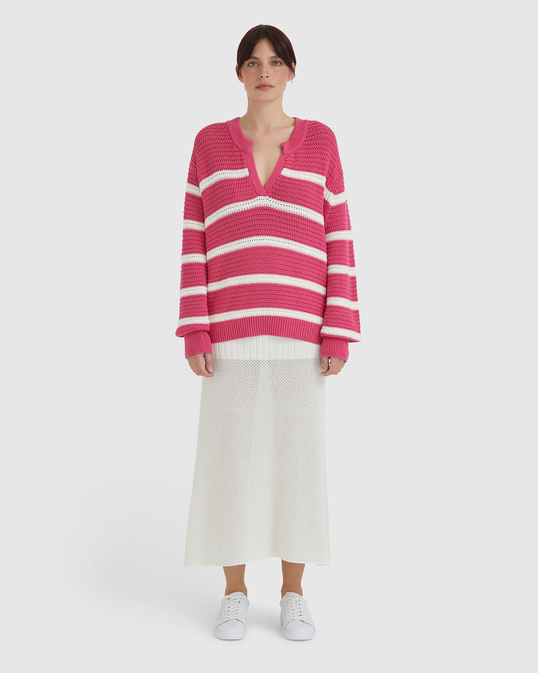 Lightweight crochet top in pomegranate, crafted from Merino wool and cotton blend.