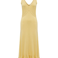 Feminine merino wool knit dress in maize with frill details.