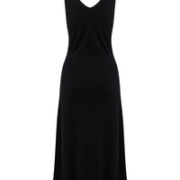 Black wool Blair Dress with a frill hem and a refined slip silhouette.