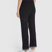 Elegant black lace pants with jersey waistband and drawstring, ideal for summer.