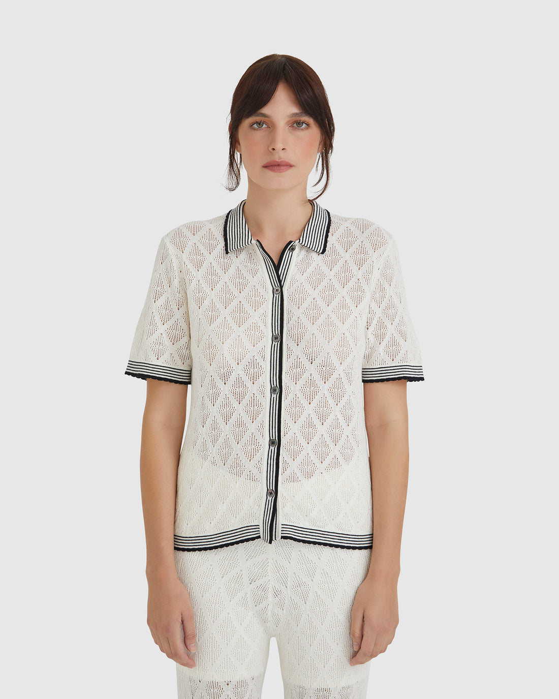 Chiara lace top in white with delicate lace stitching and scalloped trims.