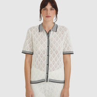 Chiara lace top in white with delicate lace stitching and scalloped trims.