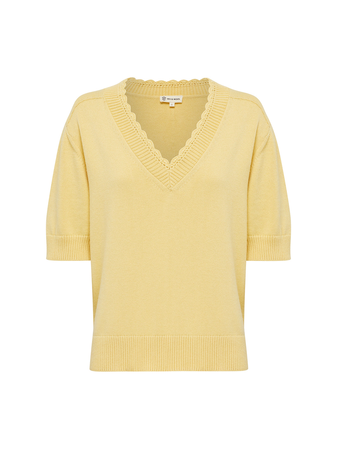 Close-up of pintuck detailing on the Elsa crochet top in maize.