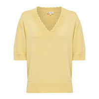 Close-up of pintuck detailing on the Elsa crochet top in maize.