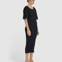Timeless wool dress with ribbed silhouette and pleated sleeve details.