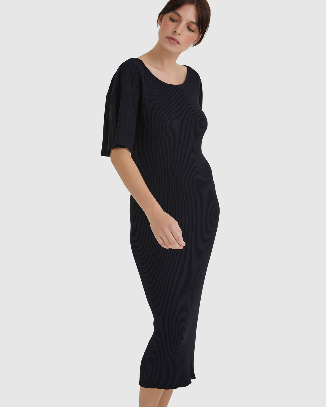 Black Fleur Pleat Sleeve Dress with fitted waist and pleated sleeves.
