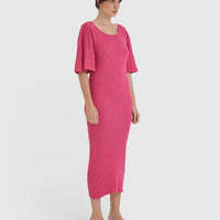 Statement merino wool dress in pomegranate with pleated sleeves.