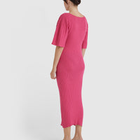 Elegant wool knit dress with pleated sleeves and fitted waist.