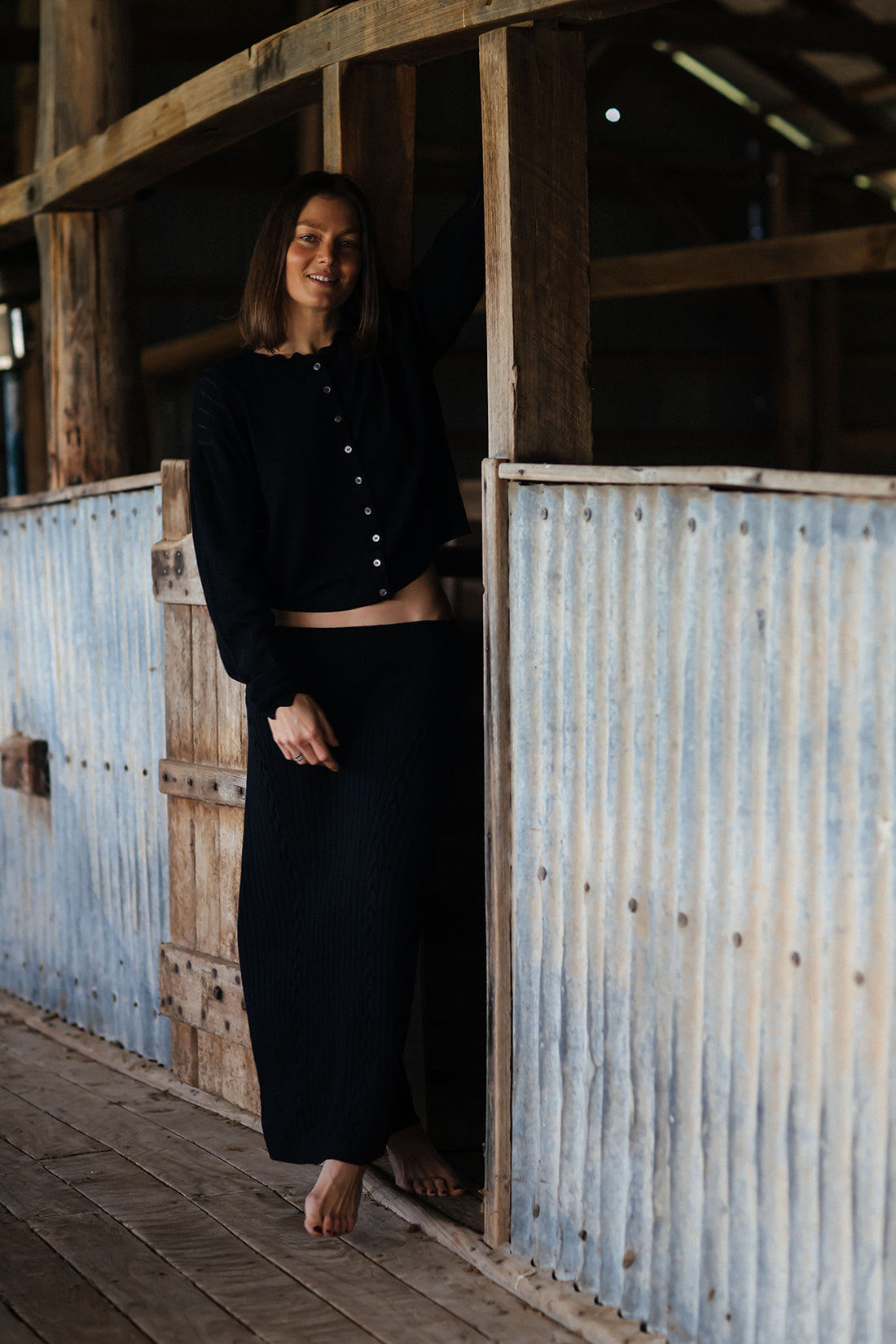 Black Grace Midi Skirt in merino wool for stylish winter wear.