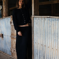 Black Grace Midi Skirt in merino wool for stylish winter wear.