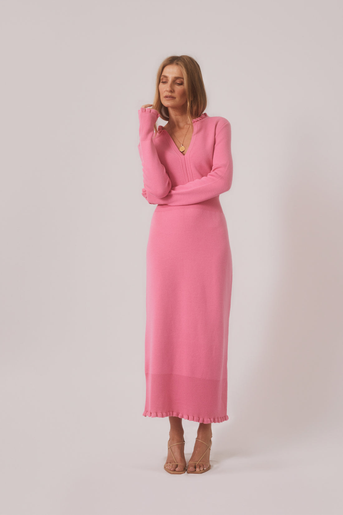 Little River Knit Dress in candy pink with ruffled cuffs and neckline.