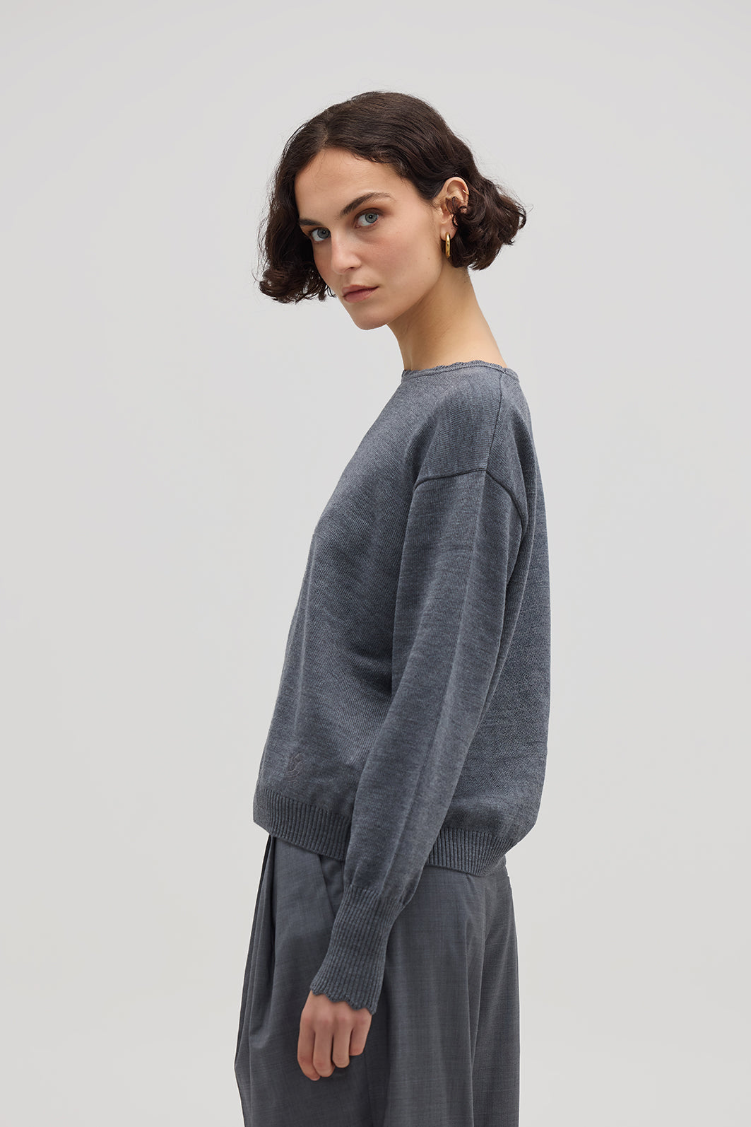 Side profile of model in Grey Wool Sweater – lightweight and effortlessly elegant knitwear