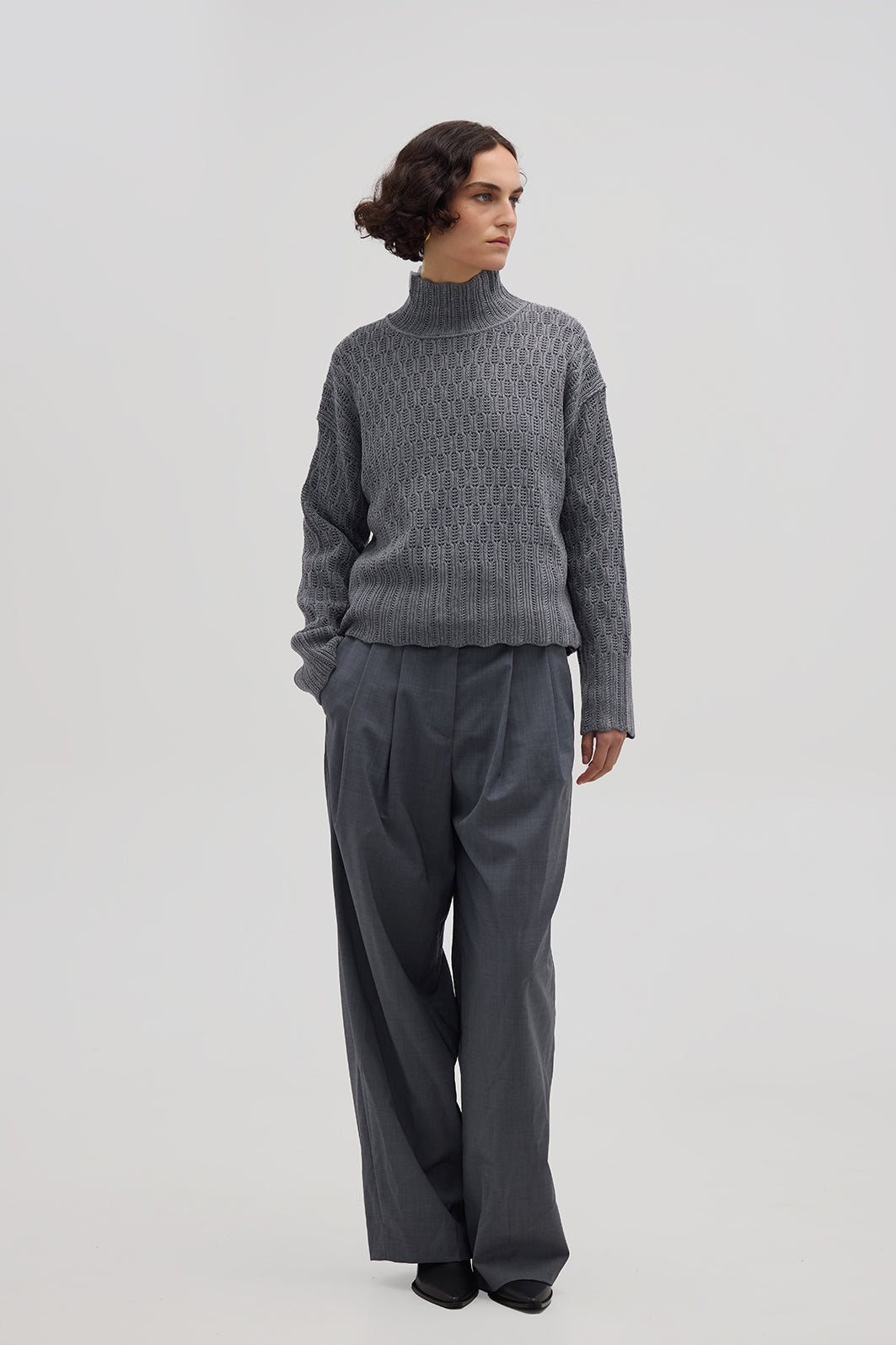Model wearing the Grey Corded Rib High Neck Merino Sweater – cozy and breathable ladies wool sweater