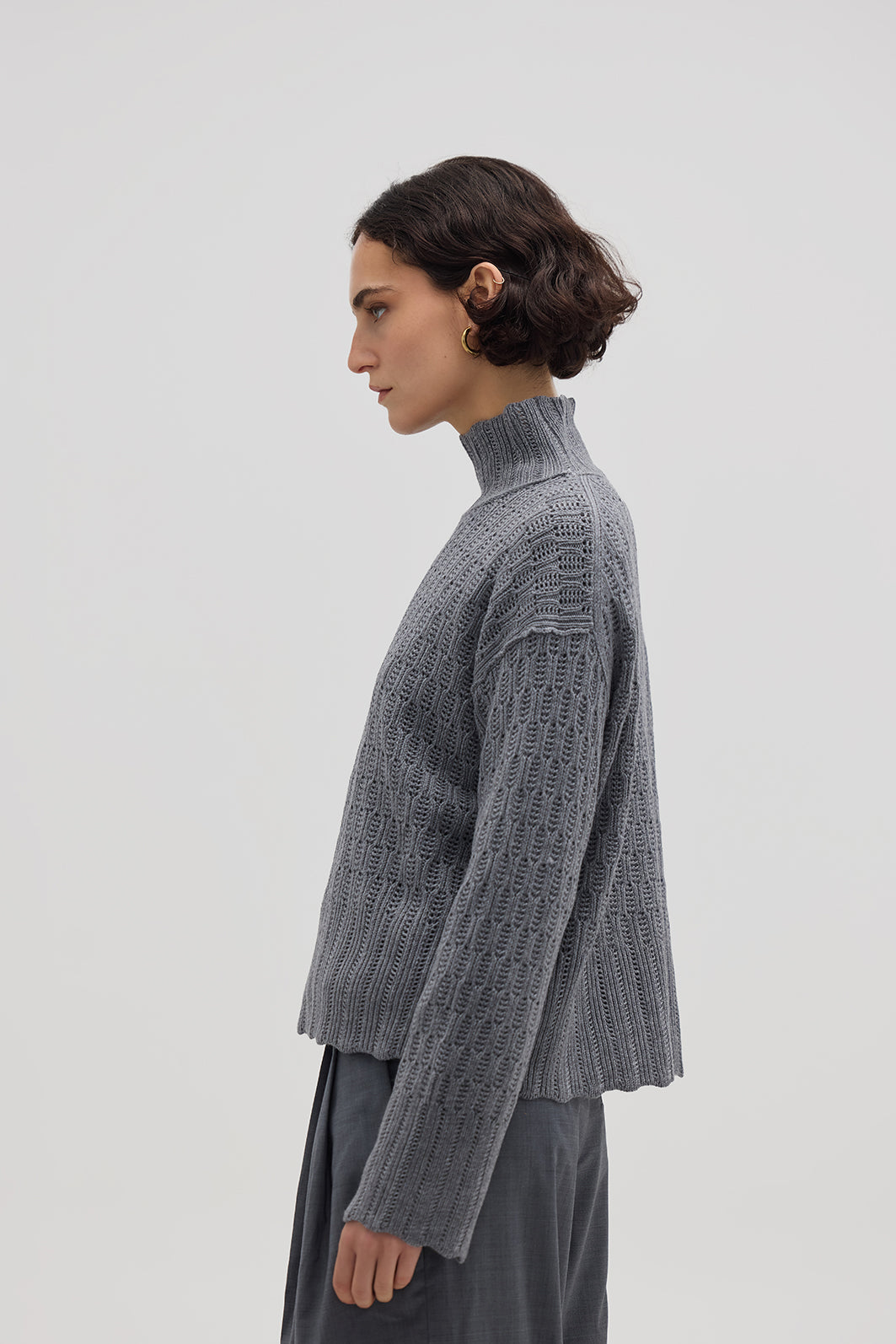 Side profile of model in Grey High Neck Wool Sweater – stylish, soft, and effortlessly elegant