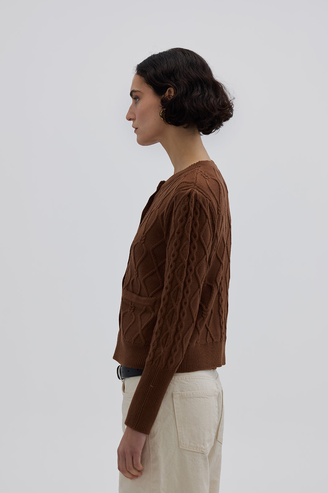 Side view of model in Brown Wool Cardigan – classic cable-knit design for effortless winter styling