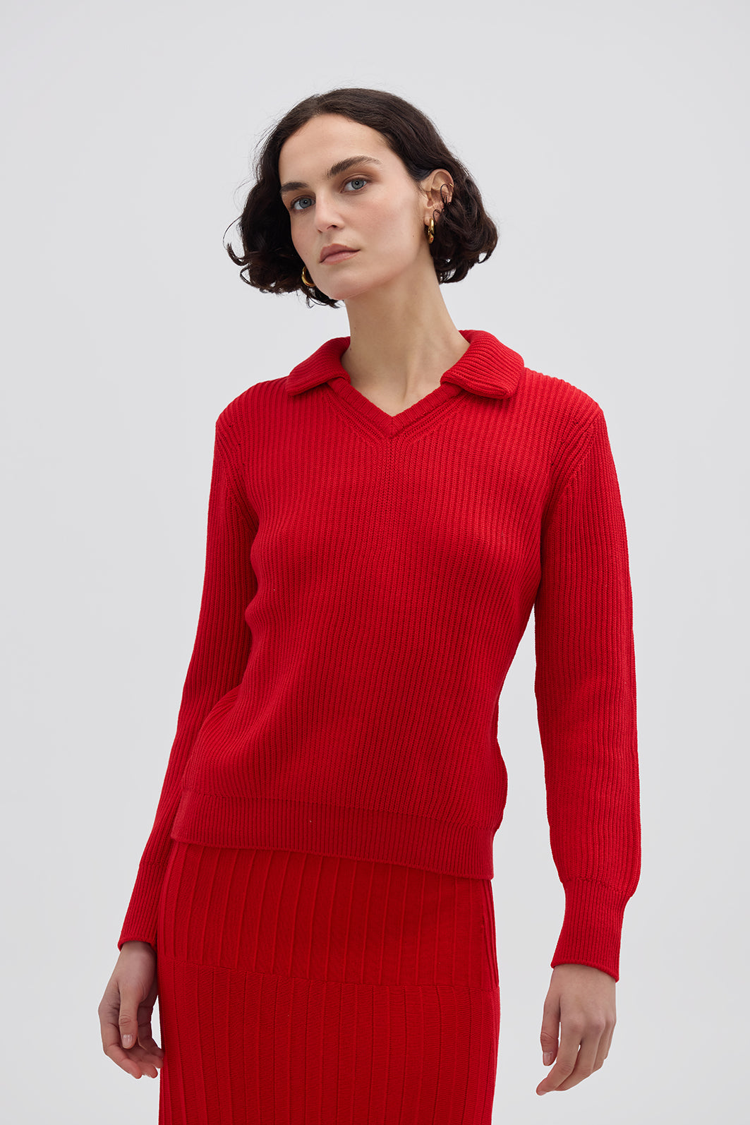 Model wearing the Red Ribbed V-Neck Merino Sweater – stylish and cozy ladies wool jumper