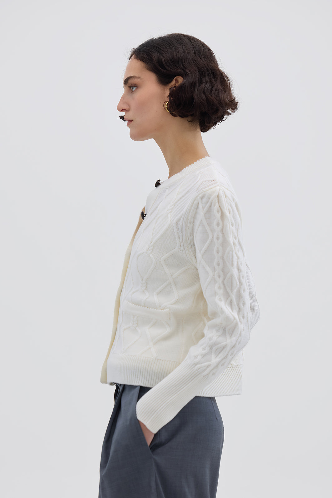 Side view of model in Cream Wool Cardigan – warm, lightweight, and effortlessly elegant