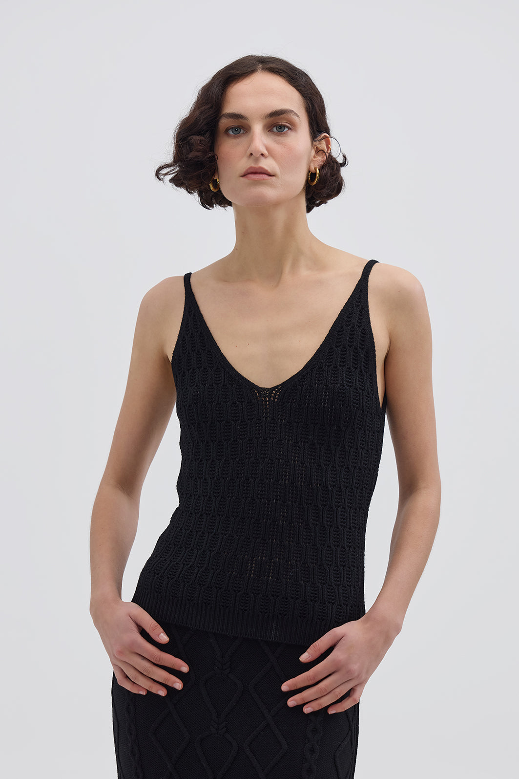 Model wearing the Black Corded Rib Merino Cami – sleek and breathable wool cami