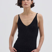 Model wearing the Black Corded Rib Merino Cami – sleek and breathable wool cami