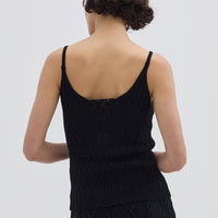 Ladies Merino Cami in Black styled with high-waisted trousers – refined and classic look