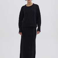 Model wearing the Black Cable Heart Merino Sweater – classic and elegant ladies wool sweater