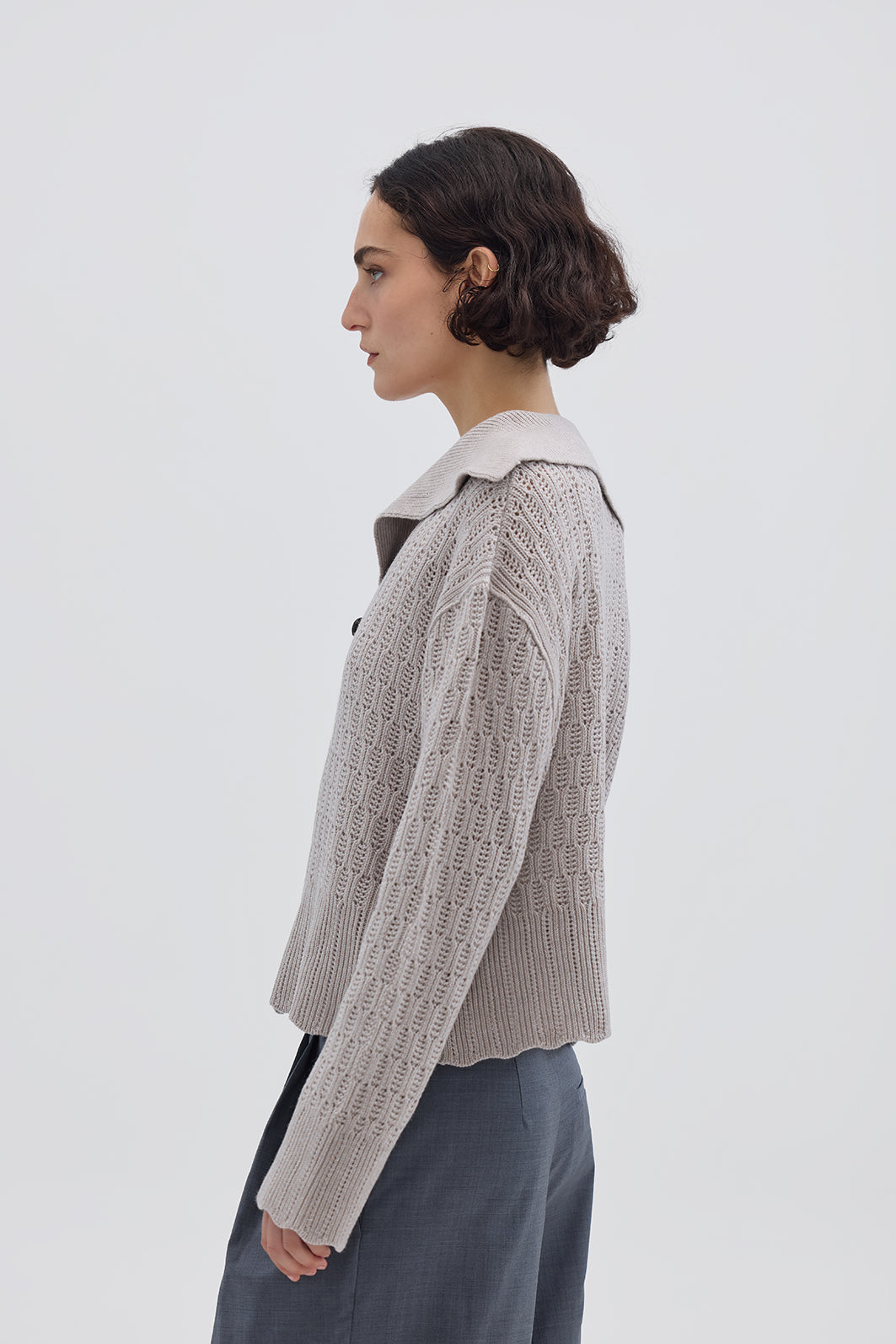 Side profile of model in Cream Wool Sweater – warm, polished, and stylish knitwear