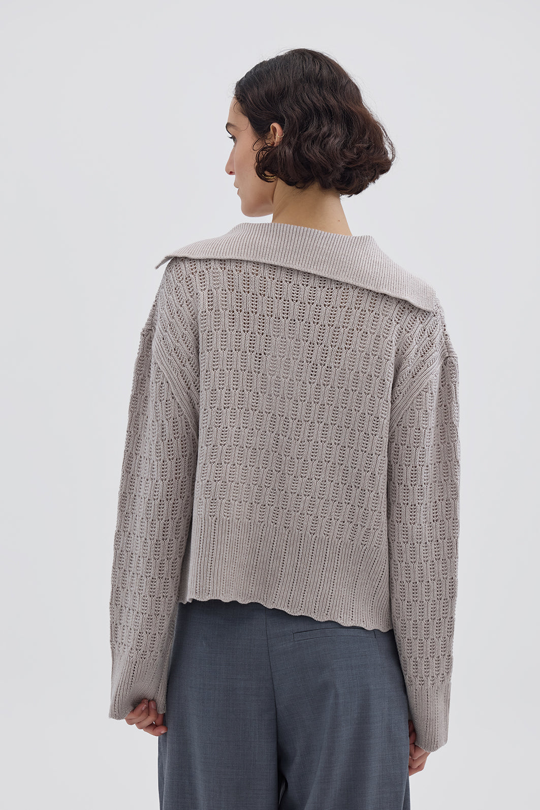 Ladies Wool Jumper in Cream styled with high-waisted trousers – effortlessly refined