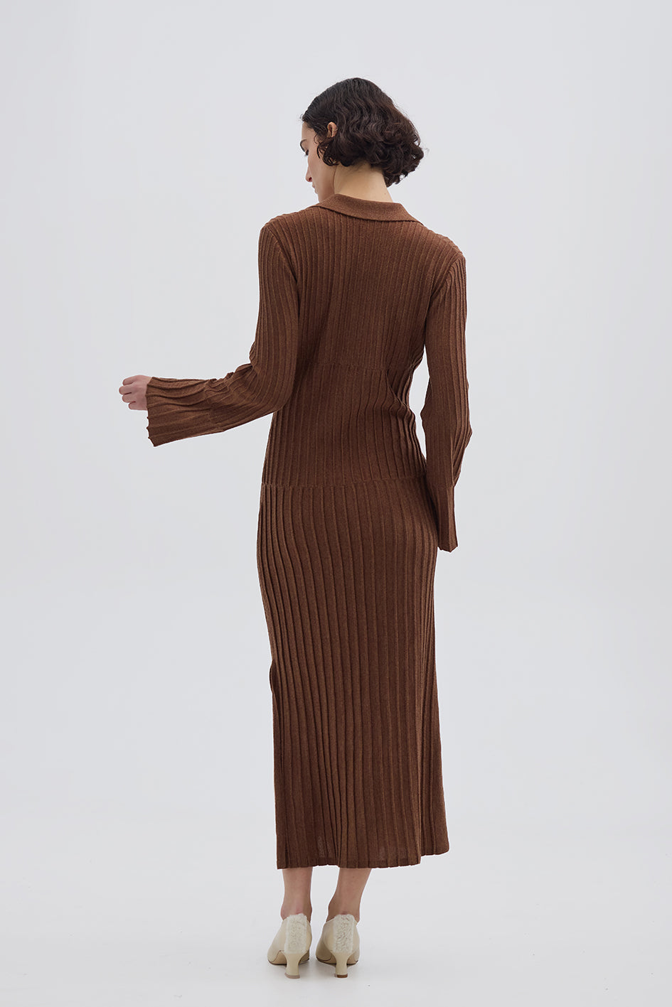 Long Wool Dress in Brown styled with a tailored coat – timeless and versatile knitwear