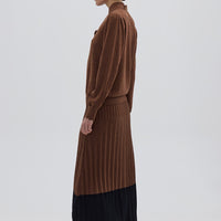 Side profile of model in Brown Wool Skirt – modern contrast detailing with a structured fit