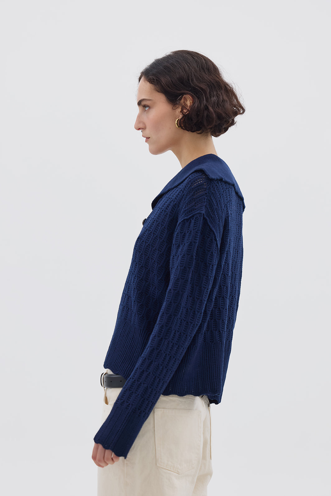 Side profile of model in Navy Wool Sweater – warm, soft, and effortlessly chic