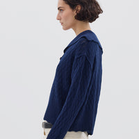 Side profile of model in Navy Wool Sweater – warm, soft, and effortlessly chic