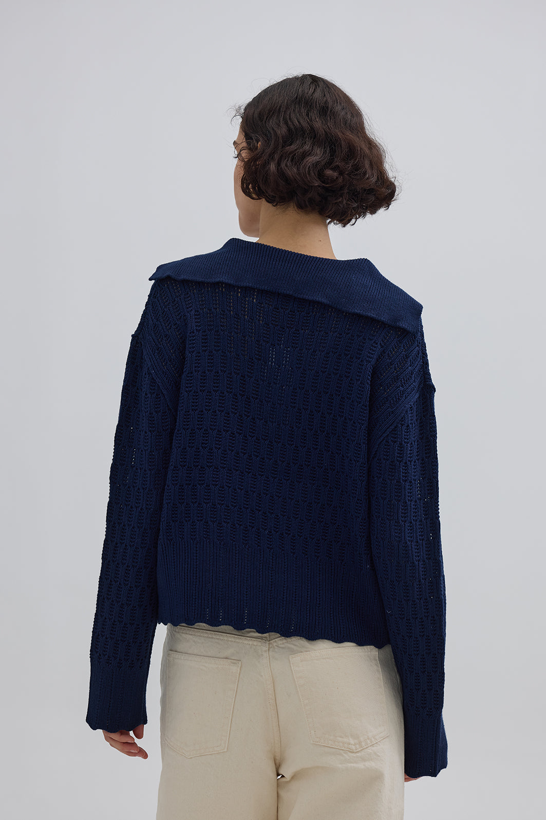 Ladies Wool Jumper in Navy styled with jeans – polished and comfortable knitwear