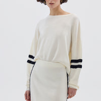 Model wearing the Cream Ruched Striped Rib Merino Sweater – stylish and breathable ladies wool sweater