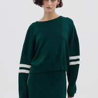 Model wearing the Emerald Ruched Striped Wool Mini Skirt – stylish and breathable Merino wool skirt