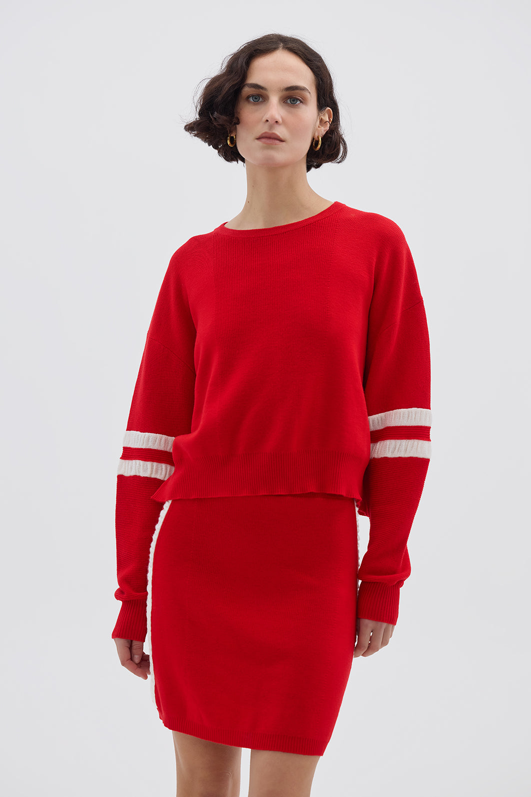 Model wearing the Red Ruched Striped Rib Merino Sweater – bold and stylish ladies wool sweater