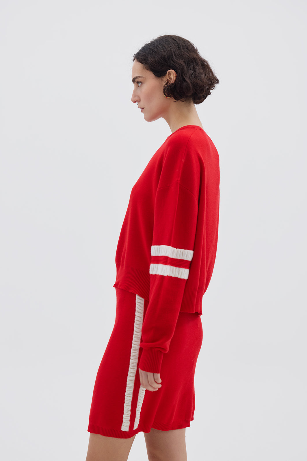 Side profile of model in Red Striped Wool Sweater – lightweight, warm, and effortlessly chic