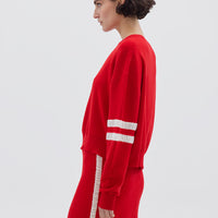 Side profile of model in Red Striped Wool Sweater – lightweight, warm, and effortlessly chic