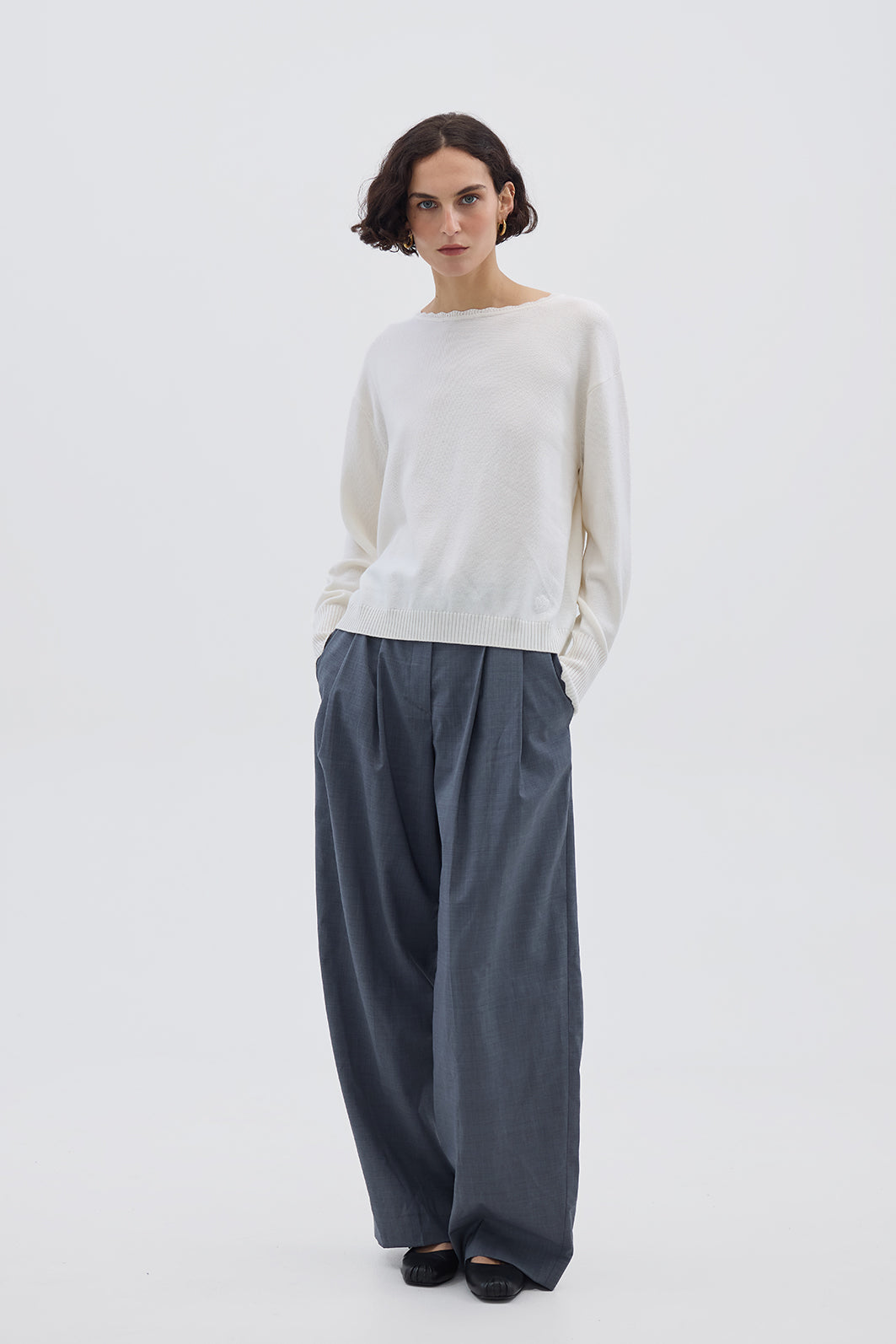 Model wearing the Cream Core Merino Wool Sweater – soft and breathable ladies wool jumper