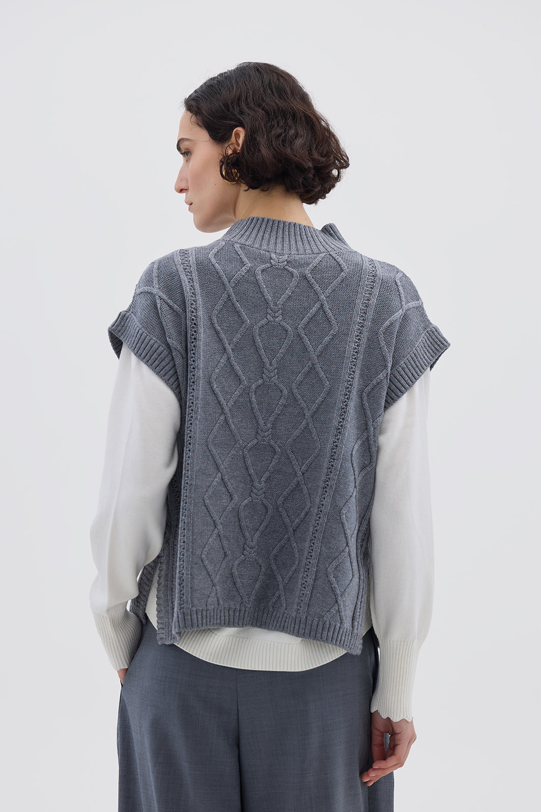Grey Sleeveless Wool Vest styled with a long-sleeve top – timeless and versatile winter outfit