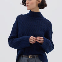 Model wearing the Navy Corded Rib High Neck Merino Sweater – stylish and breathable ladies wool sweater