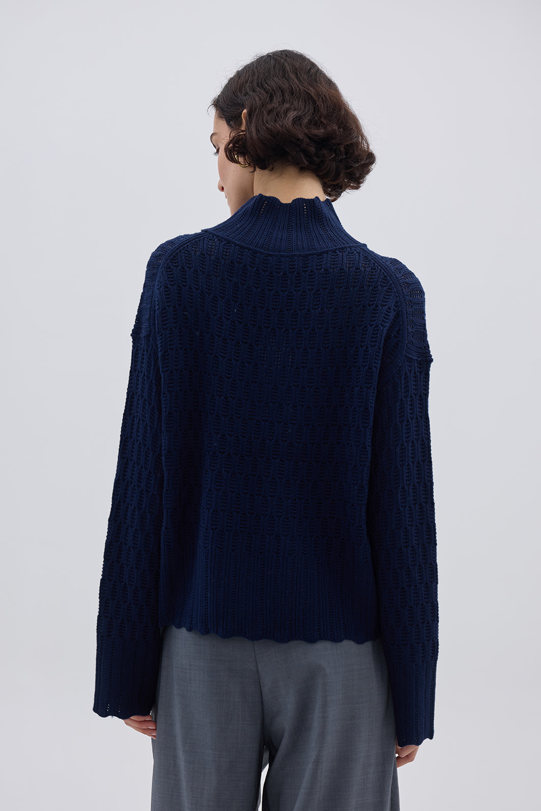 Ladies Wool Jumper in Navy styled with high-waisted trousers – elegant and cozy knitwear