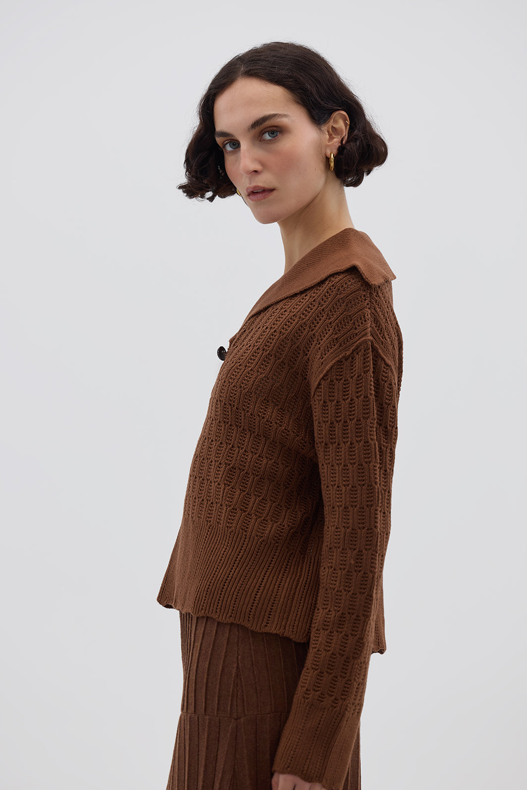 Side profile of model in Brown Wool Sweater – warm, refined, and stylish knitwear