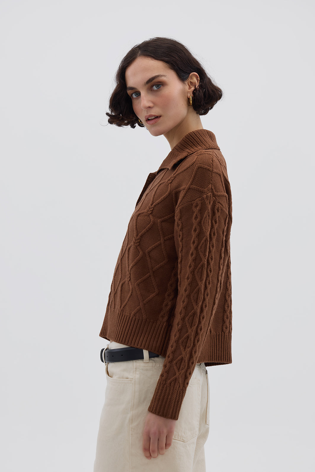 Side view of model in Brown Button-Neck Wool Sweater – refined and timeless winter knitwear