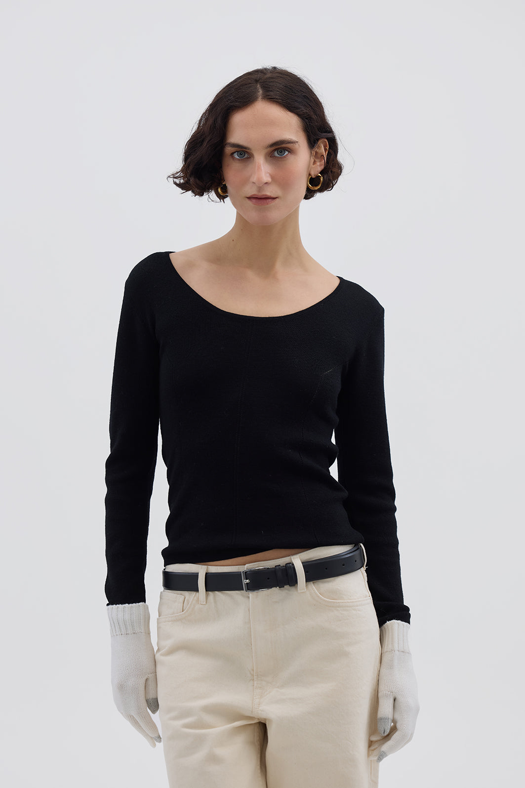 Model wearing Cream Merino Wool Gloves – soft, breathable touchscreen gloves for winter elegance