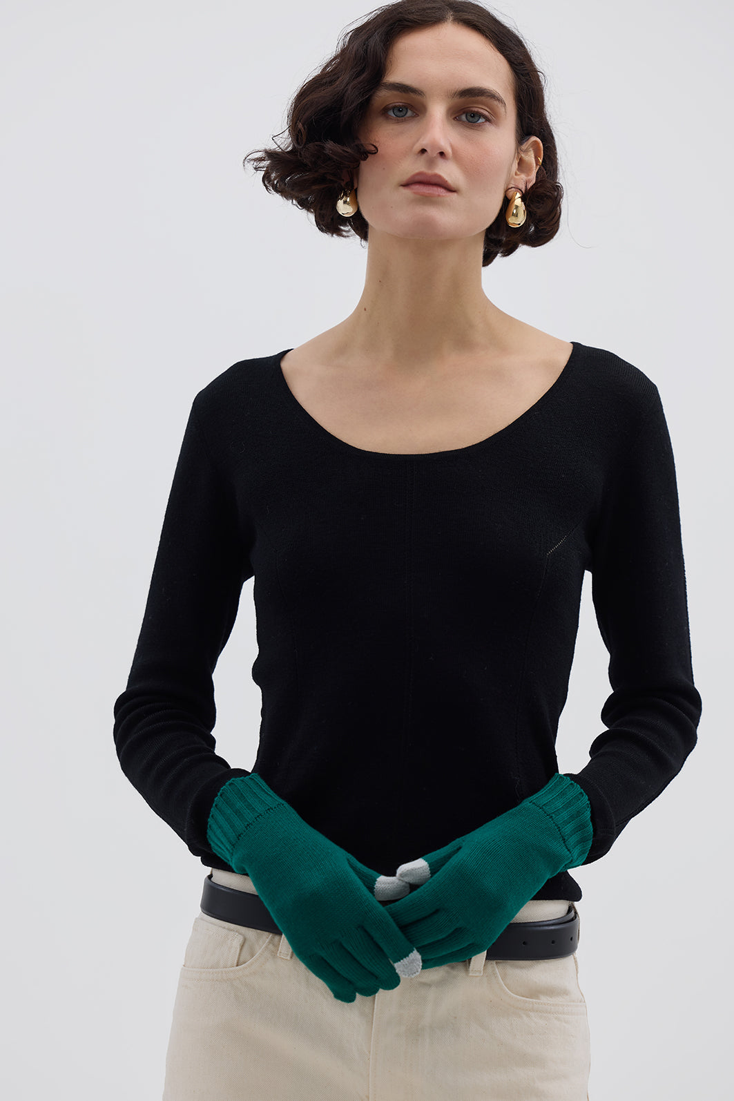 Model wearing Emerald Merino Wool Tech Gloves – stylish, breathable touchscreen gloves for winter