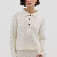 Model wearing the Cream Cable Heart Button Neck Merino Sweater – cozy and elegant ladies wool sweater