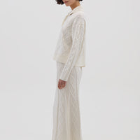 Side profile of model in Cream Merino Wool Skirt – classic and versatile winter styling