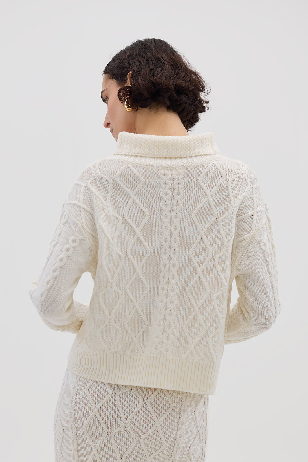 Ladies Wool Jumper in Cream – classic button-neck silhouette with intricate cable-knit texture