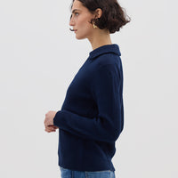 Side profile of model in Navy Collar V-Neck Merino Sweater – elegant and warm wool knitwear